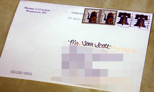 An envelope addressed to Tom Scott.